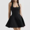 Mini-robe noire à nœuds et dos nu « Loulette »