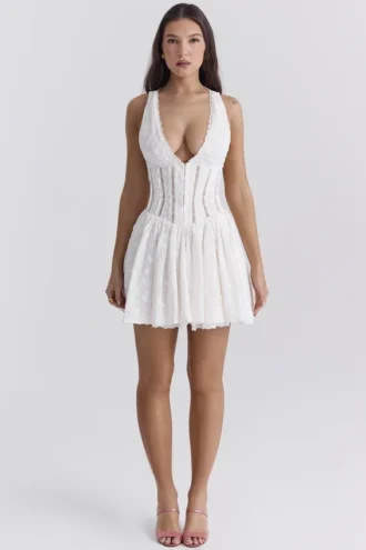 Mini-robe Sarita en coton blanc à broderie anglaise et décolleté plongeant