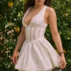Mini-robe Sarita en coton blanc à broderie anglaise et décolleté plongeant