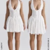 Mini-robe Sarita en coton blanc à broderie anglaise et décolleté plongeant