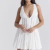 Mini-robe Sarita en coton blanc à broderie anglaise et décolleté plongeant