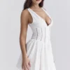 Mini-robe Sarita en coton blanc à broderie anglaise et décolleté plongeant